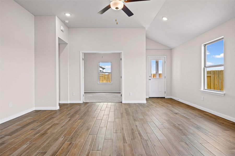 Gleaming plank floors and a vaulted ceiling elevate this open, versatile living space. Gleaming plank floors and a vaulted ceiling elevate this open, versatile living space.