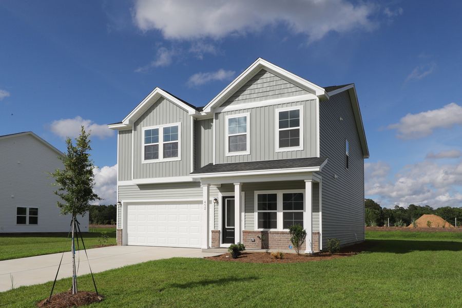 Front exterior of a new home in Garden Grove, Conway, SC, highlighting curb appeal (Image 2). Front exterior of a new home in Garden Grove, Conway, SC, highlighting curb appeal (Image 2).