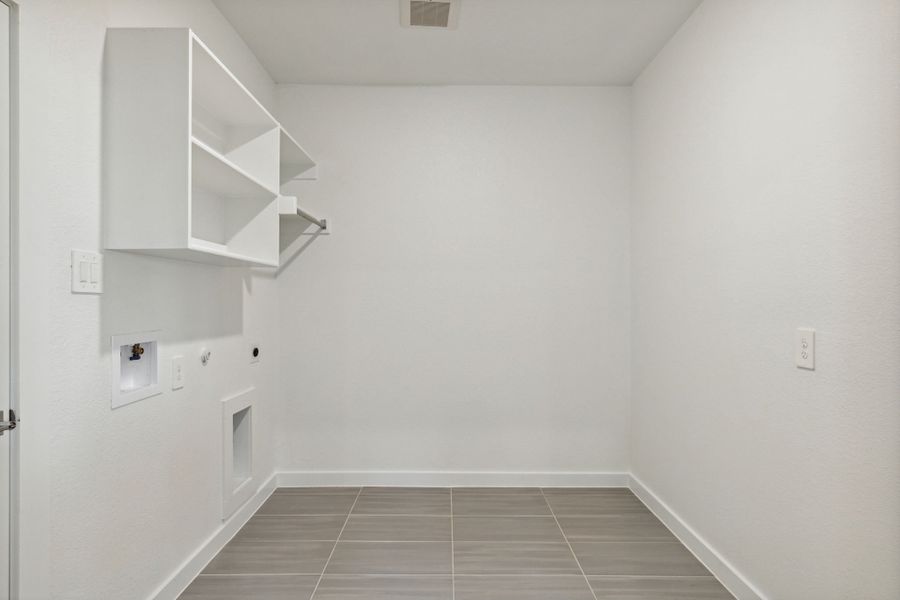 Utility Room in the Henley home plan by Trophy Signature Homes – REPRESENTATIVE PHOTO