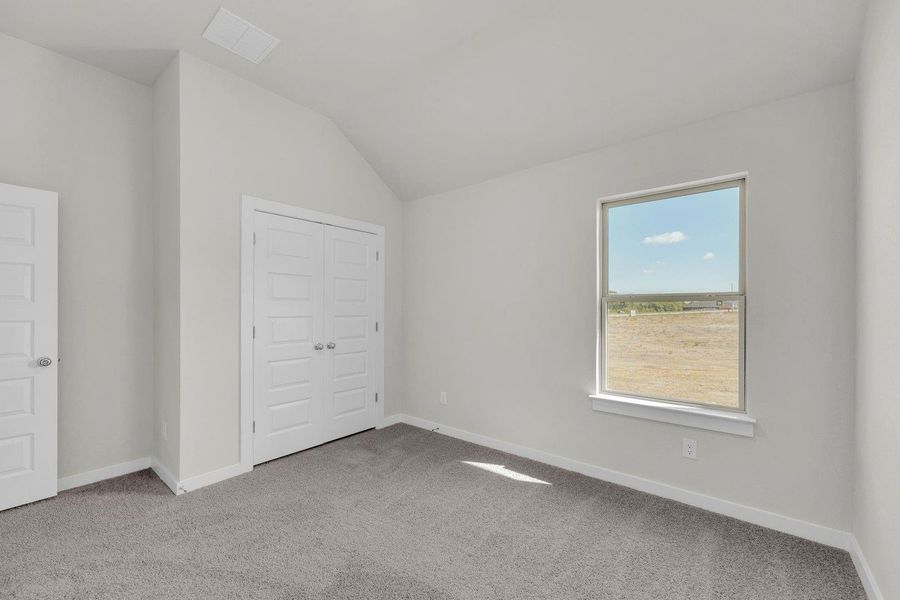 Bedroom in the Pecos home plan by Trophy Signature Homes – REPRESENTATIVE PHOTO