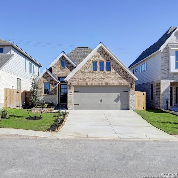Front exterior of a new home in Veranda 40', San Antonio, TX, highlighting curb appeal (Image 2).