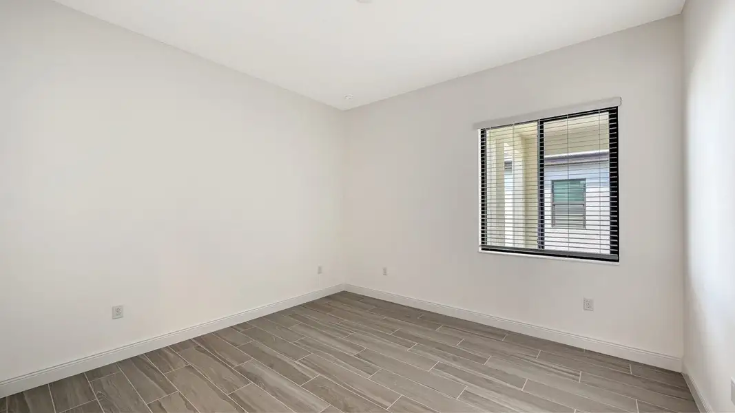 Spacious, unfurnished interior of a new home in Palm Grove Real Estate and Homes for Sale in Lakewood Ranch, FL - Neal Communities, Bradenton (Image 33).