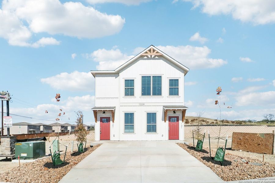 Front exterior of a new home in Magnolia Village, San Antonio, TX, highlighting curb appeal (Image 26). Front exterior of a new home in Magnolia Village, San Antonio, TX, highlighting curb appeal (Image 26).