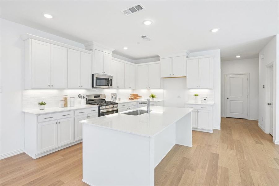 The spacious island offers the perfect place for friends and family to gather round!
