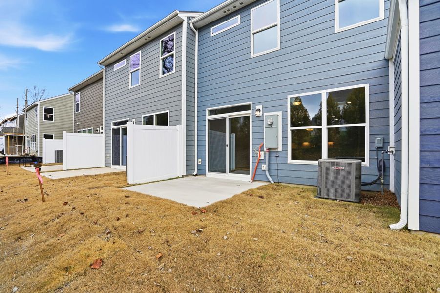 Exterior details and patio area of a home in Harrisburg Village Townhomes, Harrisburg (Image 24).