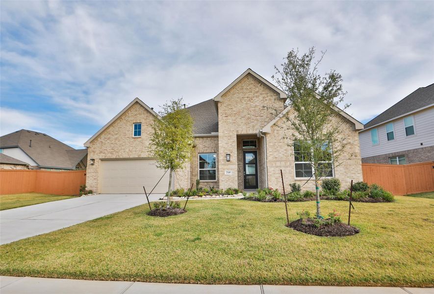 Front exterior of a new home in Sunterra, Katy, TX, highlighting curb appeal (Image 1). Front exterior of a new home in Sunterra, Katy, TX, highlighting curb appeal (Image 1).