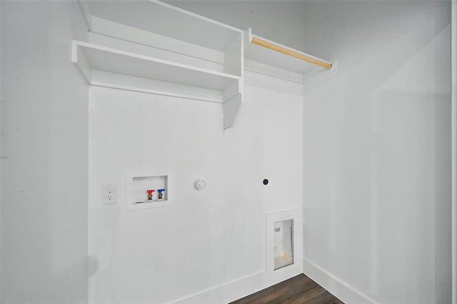 Laundry room with dark wood-style flooring, electric dryer hookup, gas dryer hookup, laundry area, and hookup for a washing machine