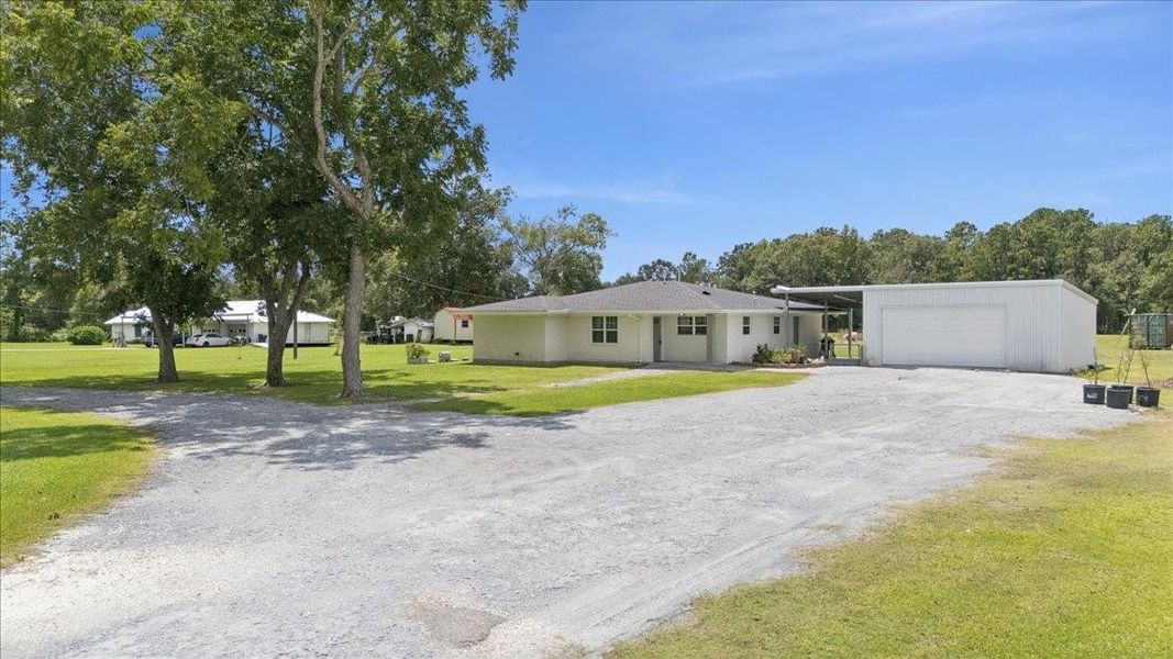 Front exterior of a new home in , Orange, TX, highlighting curb appeal (Image 19). Front exterior of a new home in , Orange, TX, highlighting curb appeal (Image 19).