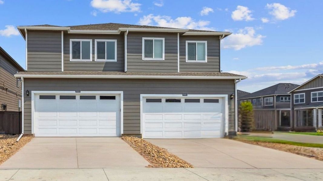 Front exterior of a new home in Vista Meadows, Fort Lupton, CO, highlighting curb appeal (Image 2). Front exterior of a new home in Vista Meadows, Fort Lupton, CO, highlighting curb appeal (Image 2).