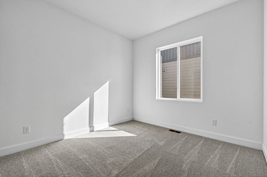 Spacious, unfurnished interior of a new home in Trailstone City Collection, Arvada (Image 14).