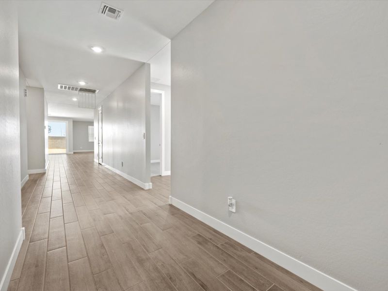 Spacious, unfurnished interior of a new home in Blossom Rock Reserve Series, Apache Junction (Image 10). Spacious, unfurnished interior of a new home in Blossom Rock Reserve Series, Apache Junction (Image 10).