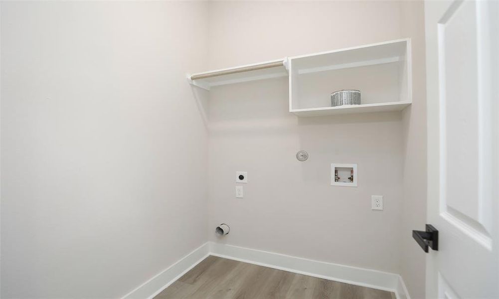 Full laundry room on 3rd floor with room for storage.