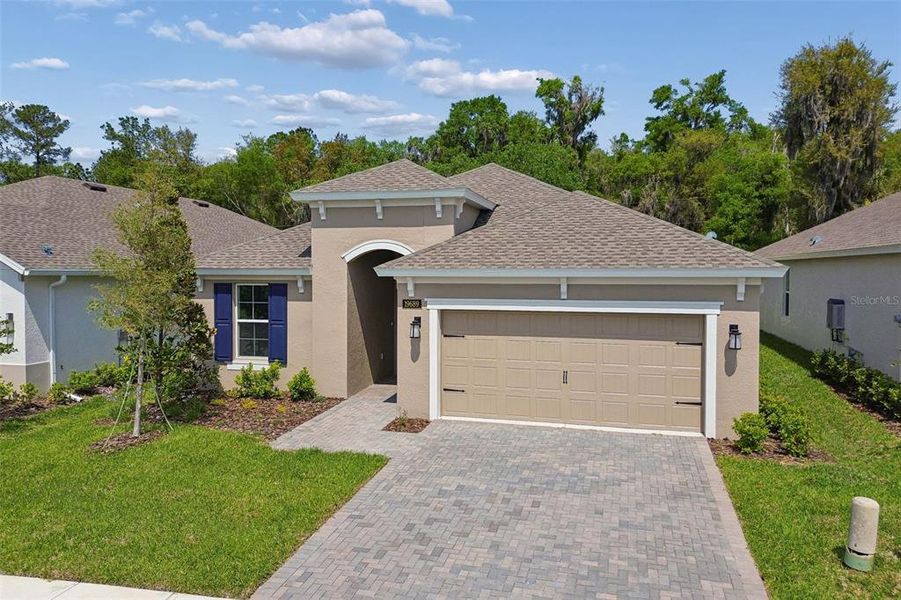 Front exterior of a new home in Cascades at Southern Hills, Brooksville, FL, highlighting curb appeal (Image 27).