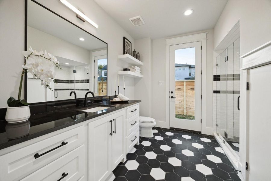 The first floor includes a full bath that can also serve as a pool bathroom. There's a separate powder room near the great room (not pictures).