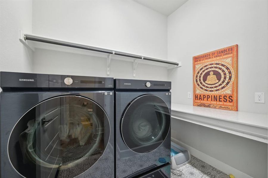 Clothes washing area with washer and clothes dryer