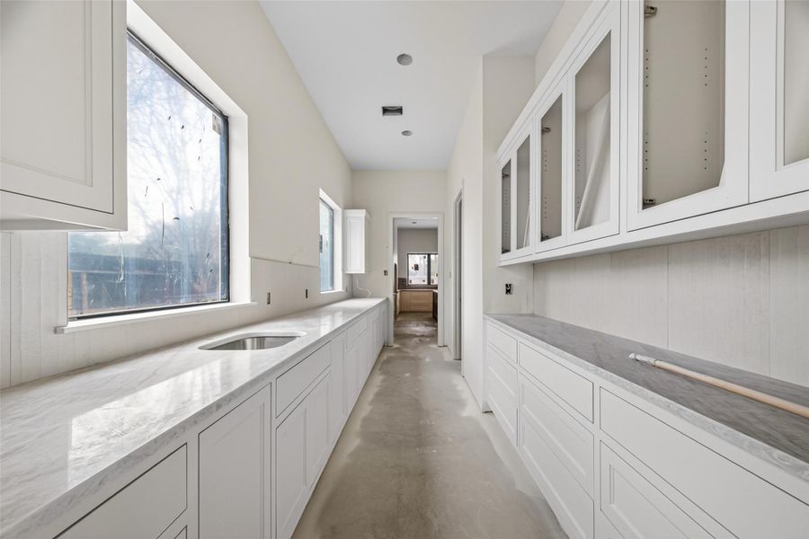 Another secondary large pantry in between the kitchen and dining room