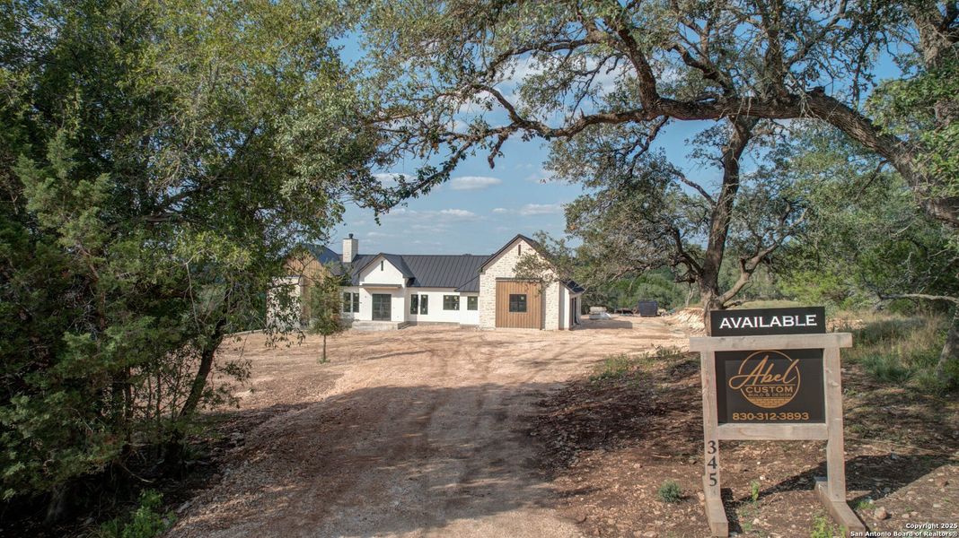 Front exterior of a new home in , New Braunfels, TX, highlighting curb appeal (Image 4). Front exterior of a new home in , New Braunfels, TX, highlighting curb appeal (Image 4).