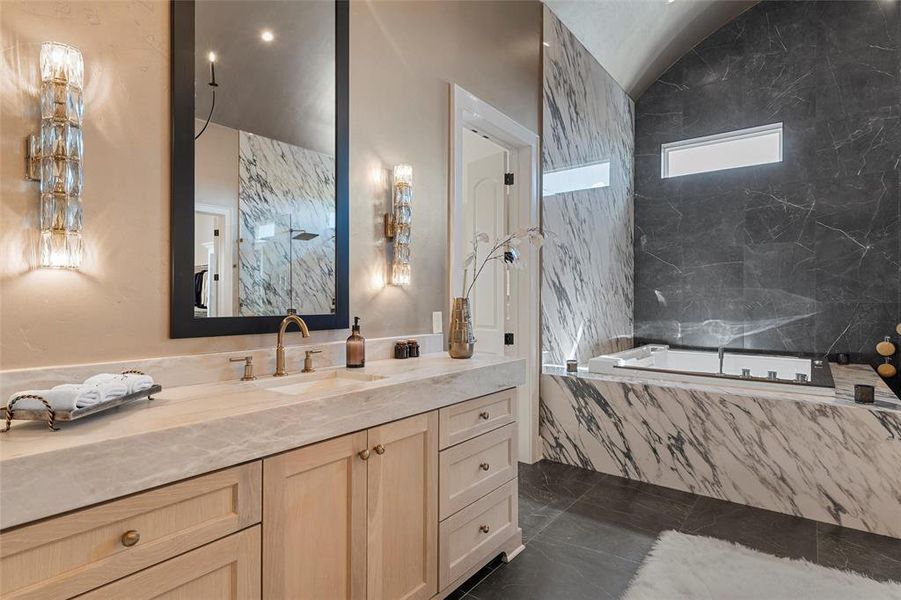 Full bath featuring vanity, a garden tub, recessed lighting, and lofted ceiling