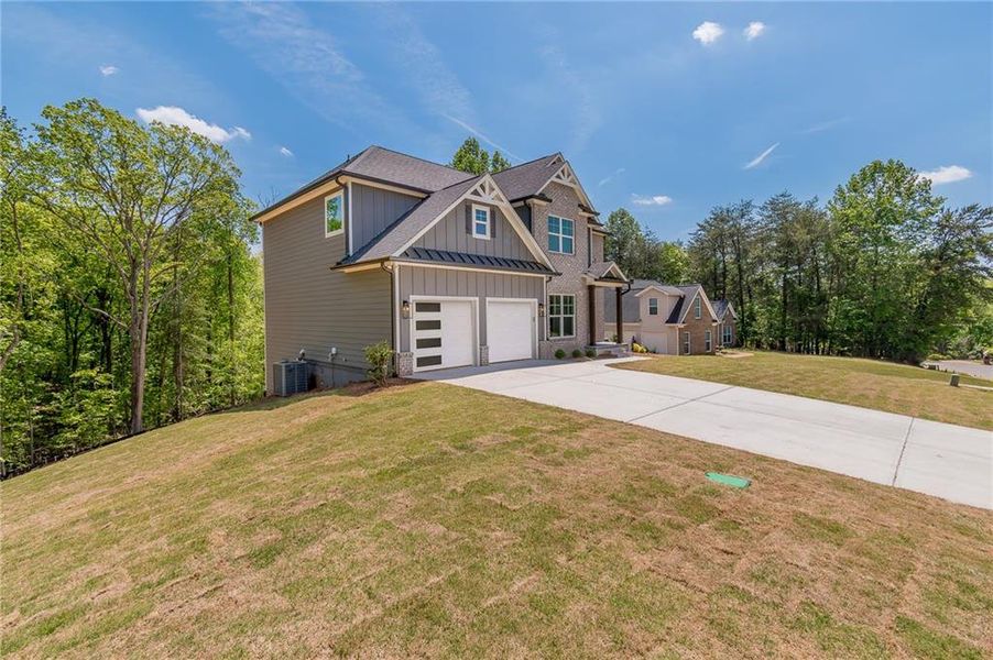 Front exterior of a new home in , Gainesville, GA, highlighting curb appeal (Image 21). Front exterior of a new home in , Gainesville, GA, highlighting curb appeal (Image 21).