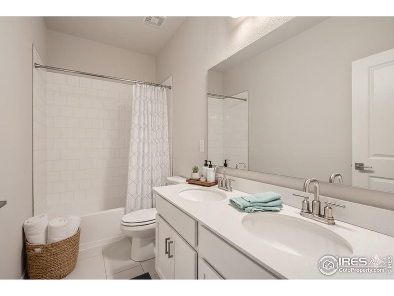 Second bathroom *Photo not of actual home, but same floorplan and style*