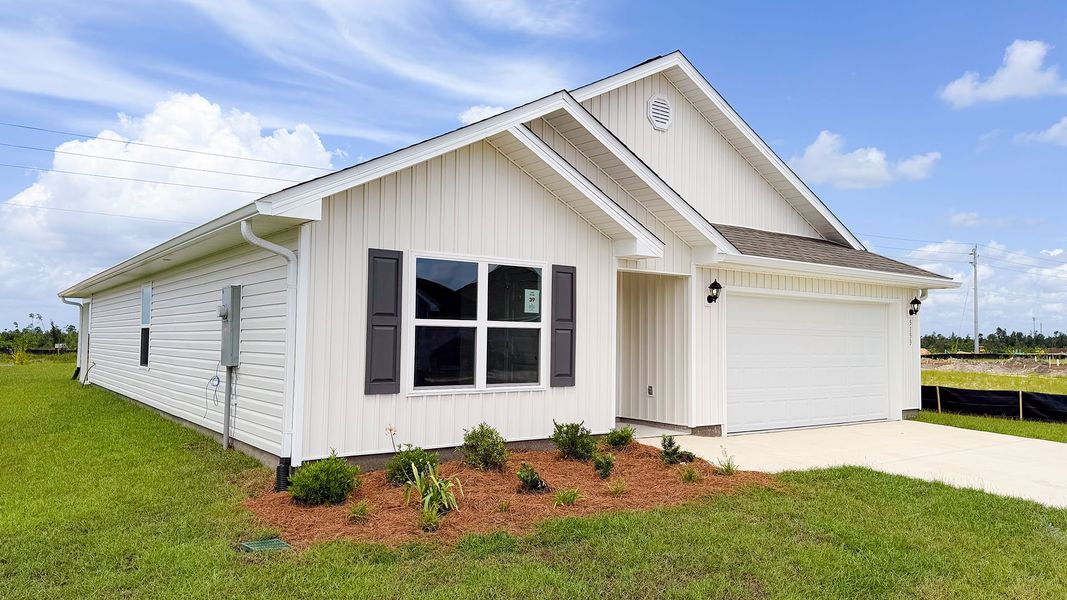Front exterior of a new home in Titus Park, Panama City, FL, highlighting curb appeal (Image 2). Front exterior of a new home in Titus Park, Panama City, FL, highlighting curb appeal (Image 2).