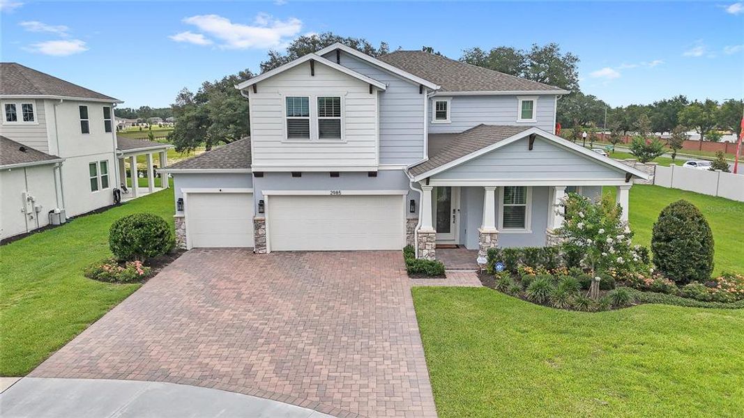 Front exterior of a new home in Acuera Estates, Apopka, FL, highlighting curb appeal (Image 29). Front exterior of a new home in Acuera Estates, Apopka, FL, highlighting curb appeal (Image 29).