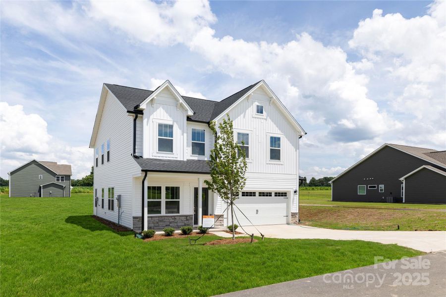 Front exterior of a new home in , New London, NC, highlighting curb appeal (Image 24).