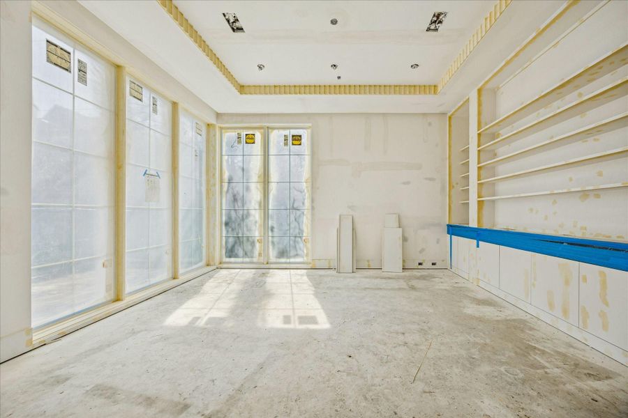 Formal study with a wall of windows facing the front of the house. Photo taken on Feb 9.