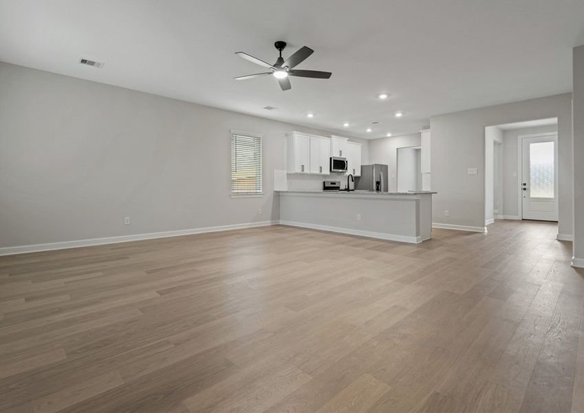 Spacious entertainment area with laminate flooring Spacious entertainment area with laminate flooring