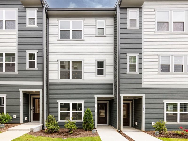 Front exterior of a new home in Context at Oakhurst, Charlotte, NC, highlighting curb appeal (Image 27). Front exterior of a new home in Context at Oakhurst, Charlotte, NC, highlighting curb appeal (Image 27).