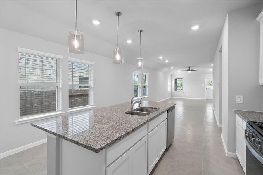 From the expansive kitchen island, enjoy seamless sightlines across the open-concept living and dining areas, making entertaining a breeze and ensuring you're never far from the conversation.