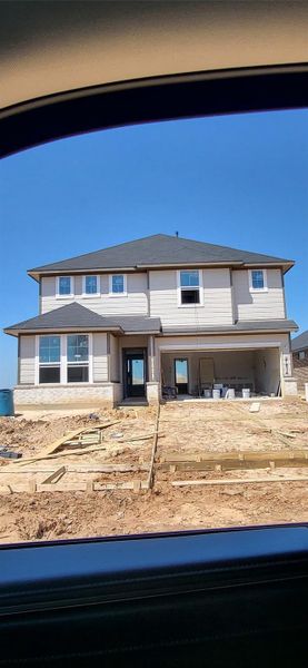 Front exterior of a new home in The Cove at Mason Woods, Cypress, TX, highlighting curb appeal (Image 2). Front exterior of a new home in The Cove at Mason Woods, Cypress, TX, highlighting curb appeal (Image 2).