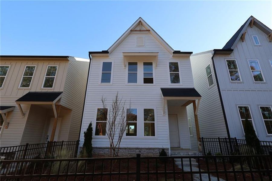 Front exterior of a new home in Celesta, Decatur, GA, highlighting curb appeal (Image 1). Front exterior of a new home in Celesta, Decatur, GA, highlighting curb appeal (Image 1).