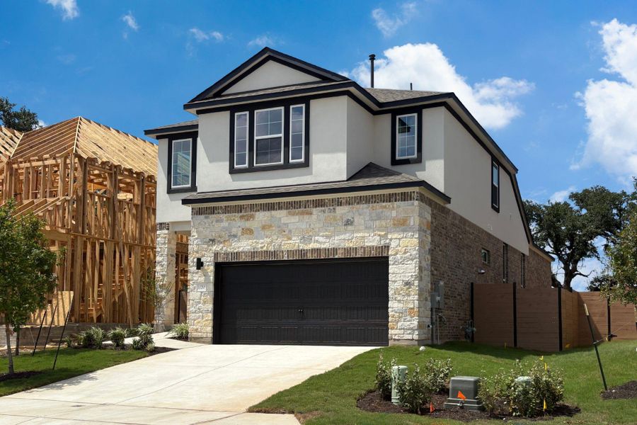 Front exterior of a new home in Highland Village, Georgetown, TX, highlighting curb appeal (Image 1). Front exterior of a new home in Highland Village, Georgetown, TX, highlighting curb appeal (Image 1).