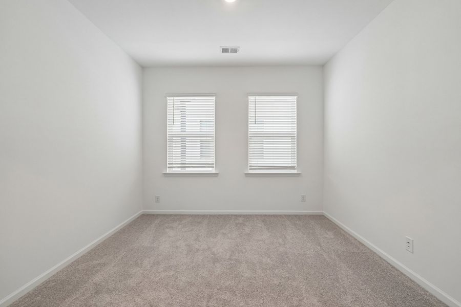 Spacious, unfurnished interior of a new home in Terraces at the Exchange, Indian Land (Image 37).