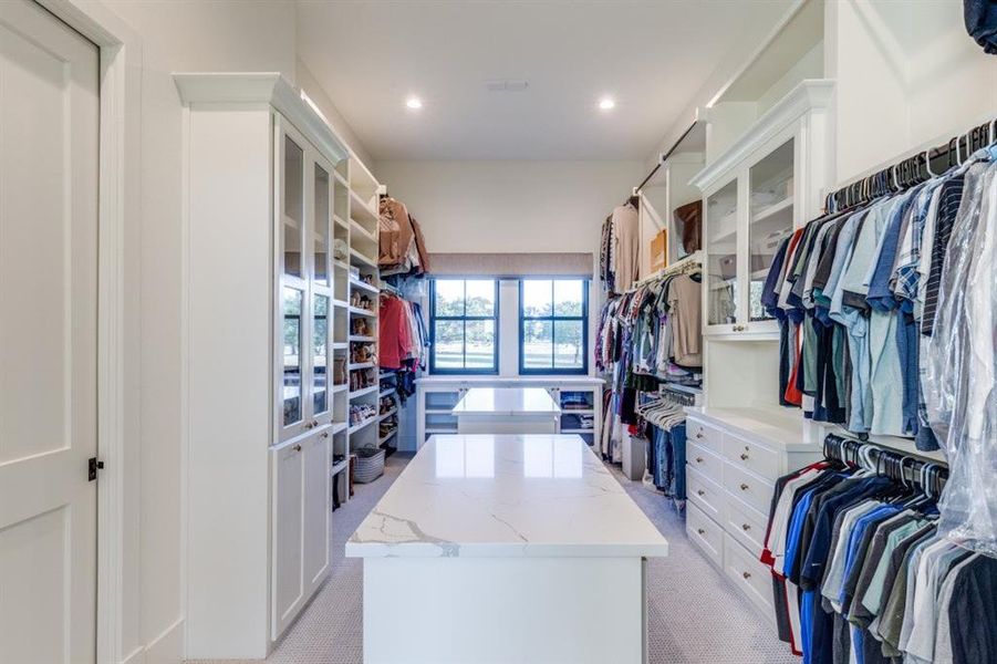 Walk in closet with light colored carpet Walk in closet with light colored carpet