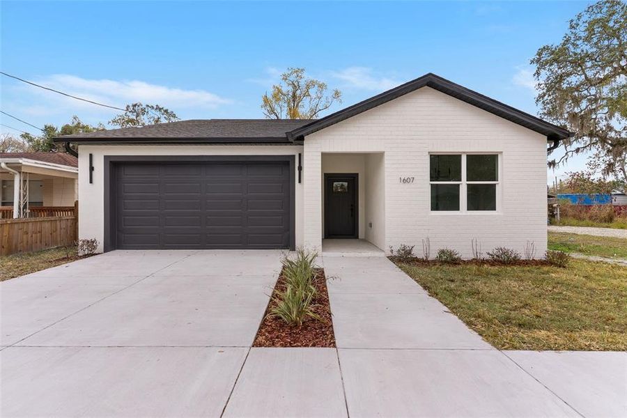 Front exterior of a new home in , Tampa, FL, highlighting curb appeal (Image 2). Front exterior of a new home in , Tampa, FL, highlighting curb appeal (Image 2).