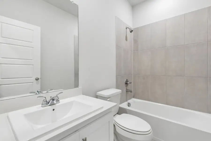 Bathroom in the Cypress home plan by Trophy Signature Homes - REPRESENTATIVE PHOTO