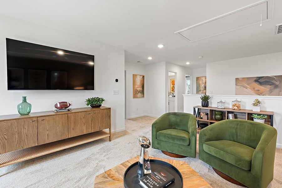 A living room with green chairs. A living room with green chairs.