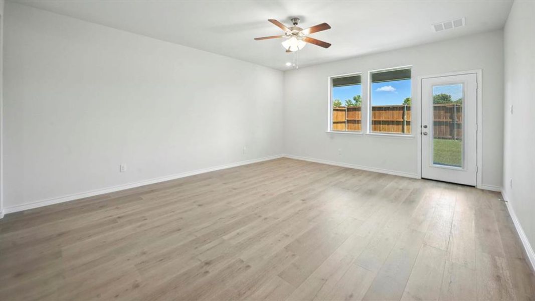 Spare room featuring light wood-style floors, ceiling fan, and recessed lighting