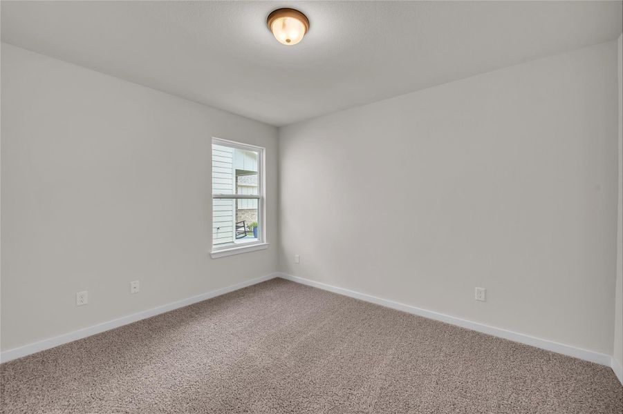 Unfurnished room featuring baseboards and carpet flooring Unfurnished room featuring baseboards and carpet flooring