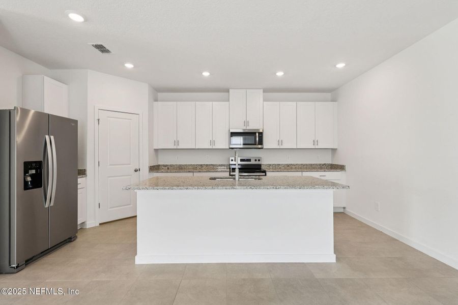 Furnished interior view inside a new home in Lakes at Bella Lago - Signature Series, Green Cove Springs (Image 11). Furnished interior view inside a new home in Lakes at Bella Lago - Signature Series, Green Cove Springs (Image 11).