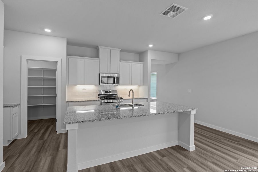 Furnished interior view inside a new home in The Meadows at Hunters Ranch, San Antonio (Image 9).