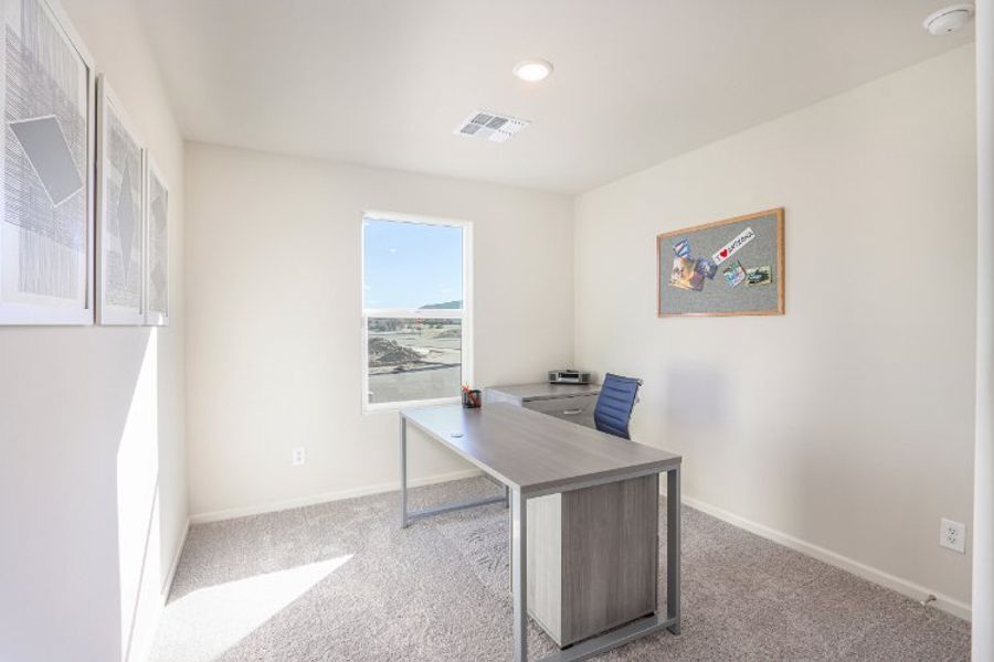 A room with a table and a chair.