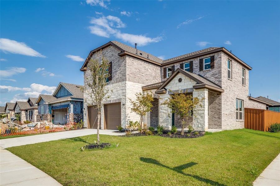 Front exterior of a new home in Heartland, Crandall, TX, highlighting curb appeal (Image 20).