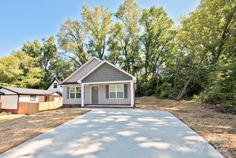 Front exterior of a new home in , Concord, NC, highlighting curb appeal (Image 14). Front exterior of a new home in , Concord, NC, highlighting curb appeal (Image 14).