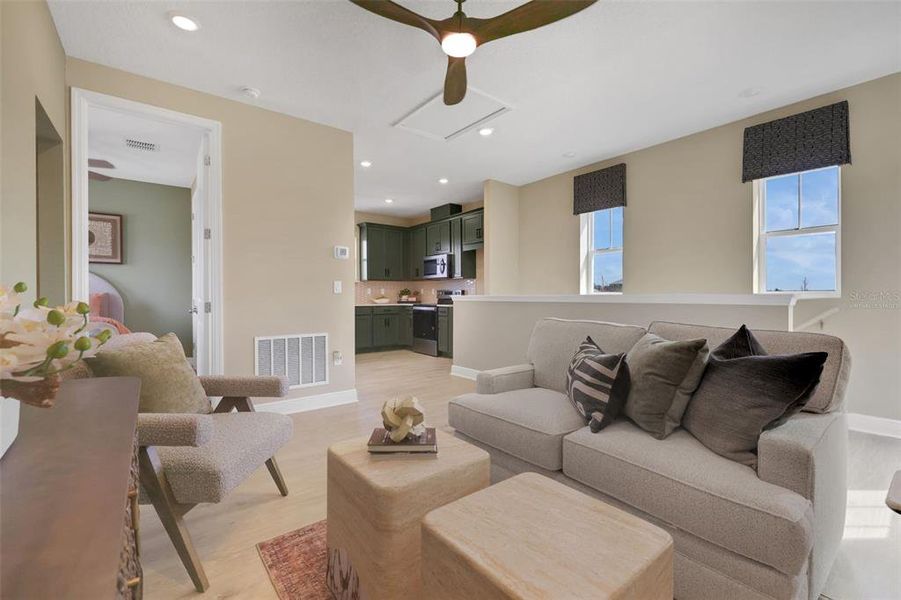 Furnished interior view inside a new home in Crossroads at Kelly Park, Apopka (Image 10).