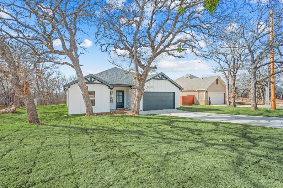Front exterior of a new home in Runaway Bay, Runaway Bay, TX, highlighting curb appeal (Image 18).