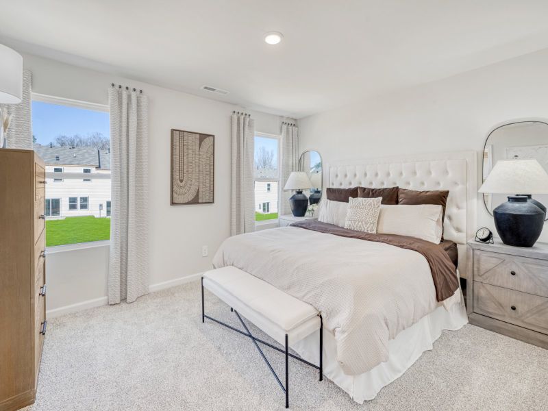 Primary bedroom in the Topaz floorplan at a Meritage Homes community in Graham, NC.