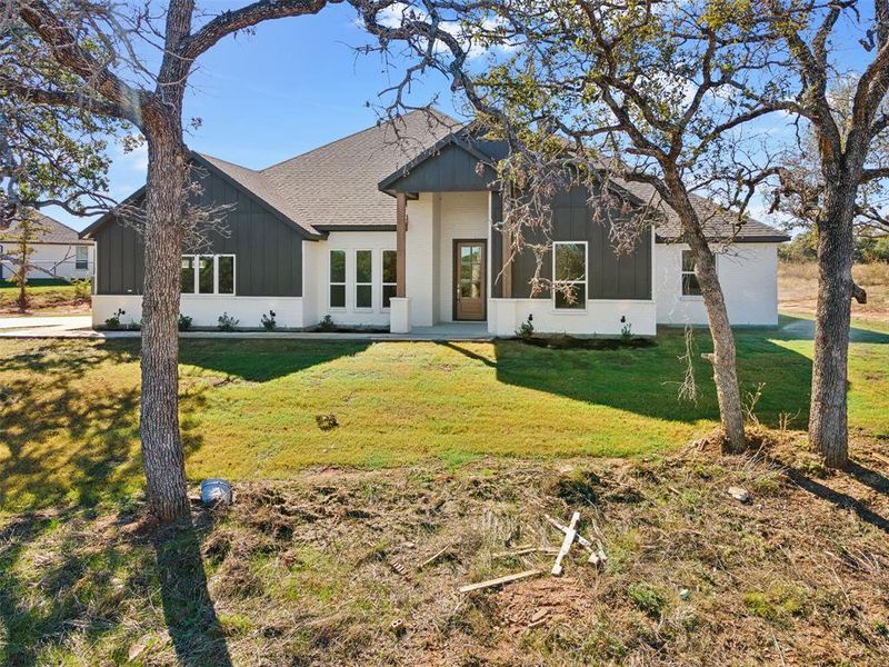 Front exterior of a new home in Lucky Ridge, Boyd, TX, highlighting curb appeal (Image 23). Front exterior of a new home in Lucky Ridge, Boyd, TX, highlighting curb appeal (Image 23).